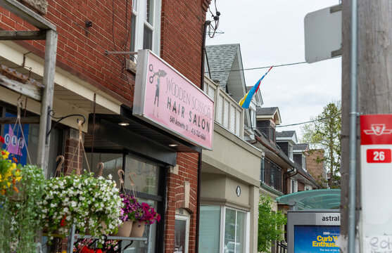 exterior of Wooden Scissors, a hair salon, located at 549 Annette Street in Toronto, Canada