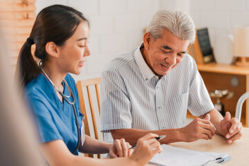 Senior Man Receives Medical Check-Up Therapy from Doctor in Hospital Clinic: Professional Health...