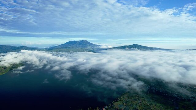 stablish Aerial View of the lake atas with a backdrop of Talang Mountain in Nagari Alahan Panjang, Solok Regency