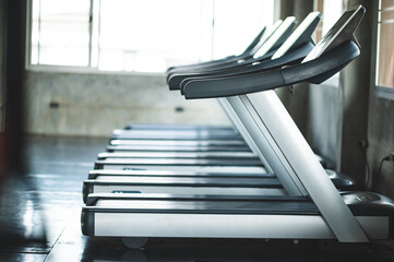 An empty Electric Treadmill equipment in the indoor gym or fitness center, concept of sport club...