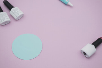 Tools for manicure on a pink and blue background. Nail files, scissors and nail polishes top view. Nail Salon, Beauty Salon