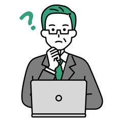 考えるノートパソコンで仕事をしている年配のスーツの男性