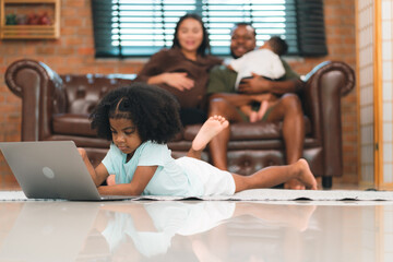 Happy African American Family at Home: Mother and Father Hug Their Young Daughter and Son, Sharing...