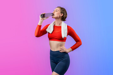 Full body length gaiety shot athletic and sporty young woman with towel and drinking water in...