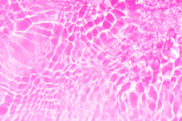 Purple water bubbles on the surface ripples. Defocus blurred transparent pink colored clear calm...