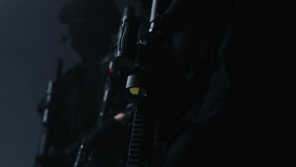 A squad of special forces armed with AR-15 rifles, fully equipped and prepared for a combat mission.