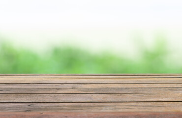 Wooden table isolated green nature blurred background