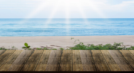 Fototapeta premium Isolated wooden table, blurred background, sea, beach for advertising
