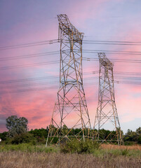 Electricity pylon against a pink sky.  Photographed inside Rietvlei Nature Reserve, Gauteng, South Africa.