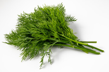 Vibrant green dill bunch isolated on a white surface, ideal for culinary concepts
