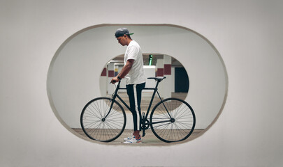 Architecture, bicycle and man with creativity, design and bike with thinking for ideas and vision....