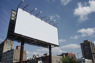 Urban landscape with a blank white billboard, perfect backdrop for creative ad designs.