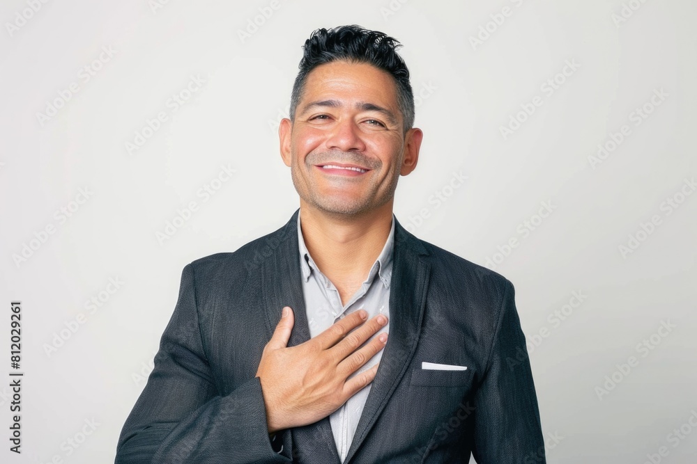 Poster a man in a suit smiling with hands on chest. perfect for business and professional concepts
