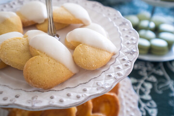 detail of a Candy table. Sweets on a festive celebration table. There are cookies, chocolates, chocolate eggs, cakes and different kind of candies