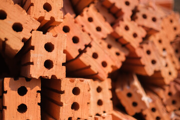 Red brick clay brick stacked on each other, construction building concept, copy space background texture.