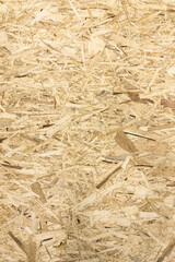 Construction materials store. OSB board texture close-up. Sale of materials for construction and packaging of goods.