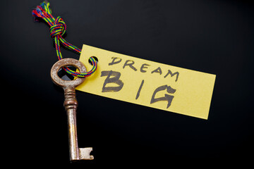 Key with BIG DREAM written on paper