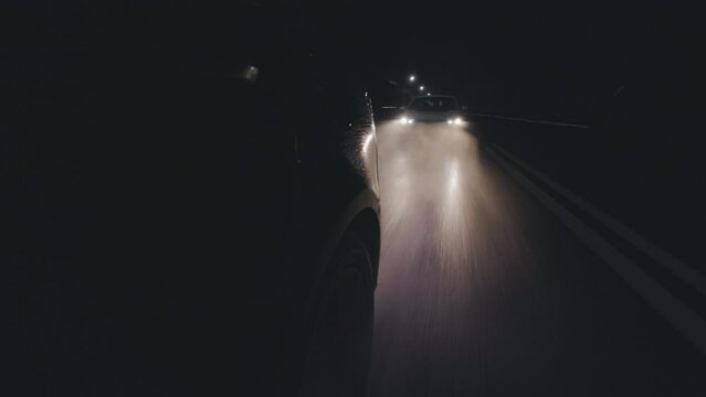 Police in pursuit , amidst rain and darkness. Action-packed footage captured with a first-person camera, showcasing dynamic intensity