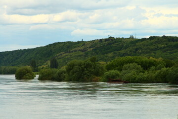 A body of water with trees on the side