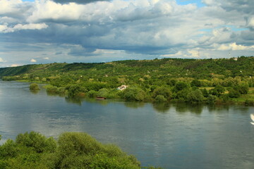 A body of water with trees on the side