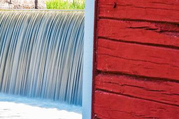 Red Building With Waterfall
