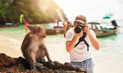 Man, camera and monkey with holiday, beach and tropical island with getaway trip, Bali and tourism....