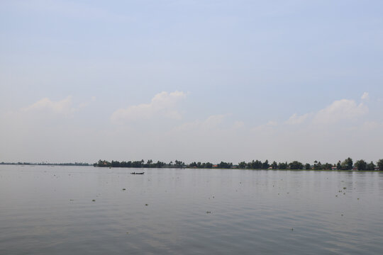 Small fishing boat and island in lake