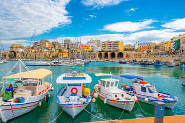 Colorful boats in the old venetian port of Herakleio in Crete, Greece