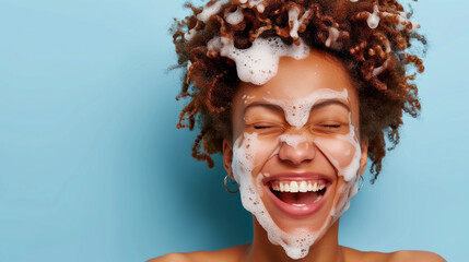 advertising of products for cleansing the female skin of the face. joyful curly woman with a face full of foamy cleanser place for the text