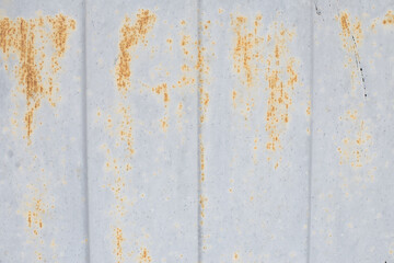 Rusty metal abstract background. Texture of an old blue grunge metal plate with cracked paint.