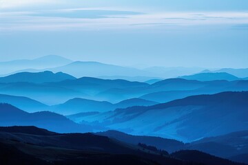 Fototapeta premium Scenic Mountain Range at Sunset. Rolling Hills and Rugged Peaks Silhouetted Against Blue Sky