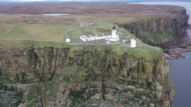 Aerial video of a lighthouse and area at Dunnet Head in Caithness