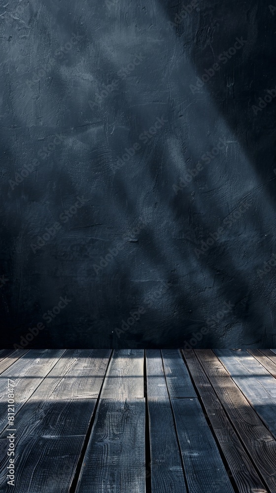 Poster a dark room with a wooden floor and a window. the room is empty and the light is shining through the