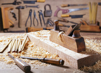 old tools: wooden planer and chisel  in a carpentry workshop