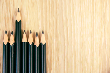 An 2B Pencils or black pencil with wooden background, desk or floor, concept of education...
