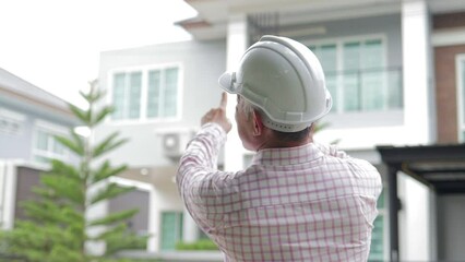 Engineer or home construction contractor The house is being checked for completeness in order to deliver it to the owner.