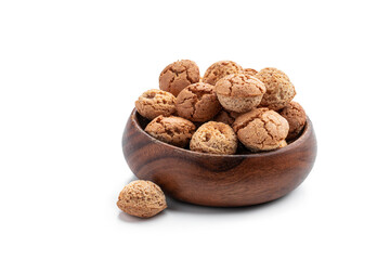 Homemade mini sugar cookies in wooden bowl isolated on white