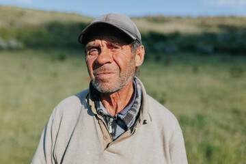 Agricultural Wisdom Senior Shepherd Farmer Stands Proud in Nature
