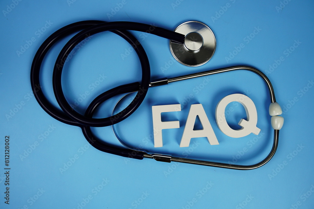 Poster faq with wooden blocks alphabet letters and stethoscope on blue background