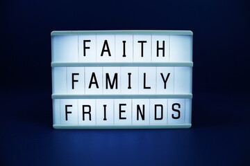 Faith Family Friends letterboard text on LED Lightbox on blue background