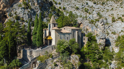 small church perched on the mountain reachable via a long and winding staircase. at the foot of the mountain there is a small characteristic town. the church is isolated from everything in the nature