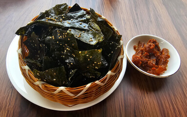 Experience the unique flavors of Luang Prabang food with Kai Paen Juen, fried rock algae chips,...