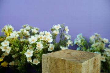 Wooden podium display scene stage showcase front view with copy space and flowers decoration on purple background