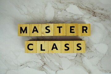 Master Class with wooden blocks alphabet letters on marble background