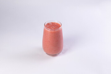 Pink smoothie on a light background.