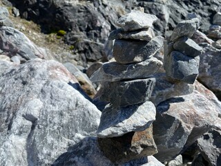 pyramid of balanced stones. tower of minerals in a rocky mountainous area. natural horizontal background. photography was taken in Republic of Karelia in Russia