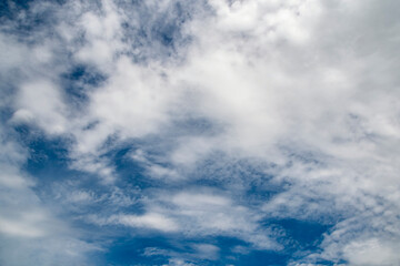 The sky is blue and cloudy. The clouds are white and fluffy