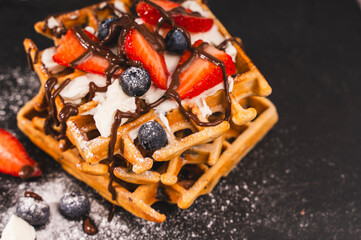  Waffles with cottage cheese cream, strawberries and blueberries, sprinkled with powdered sugar and...