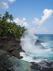 Waves crashing on the cliffs at Piscina Beach