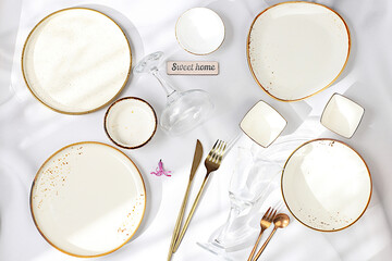 Elegant festive table setting. Set of beautiful cutlery on a marble background, menu layout in a...